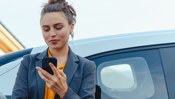 woman-leaning-on-side-window-of-vehicle