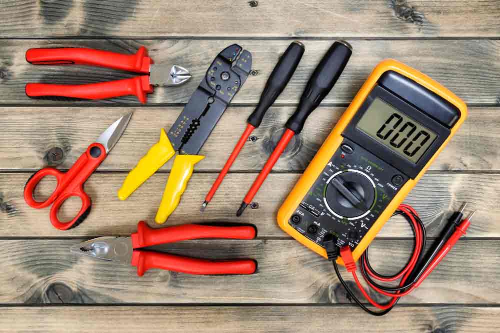 Close up image on electrical tools on wooden table