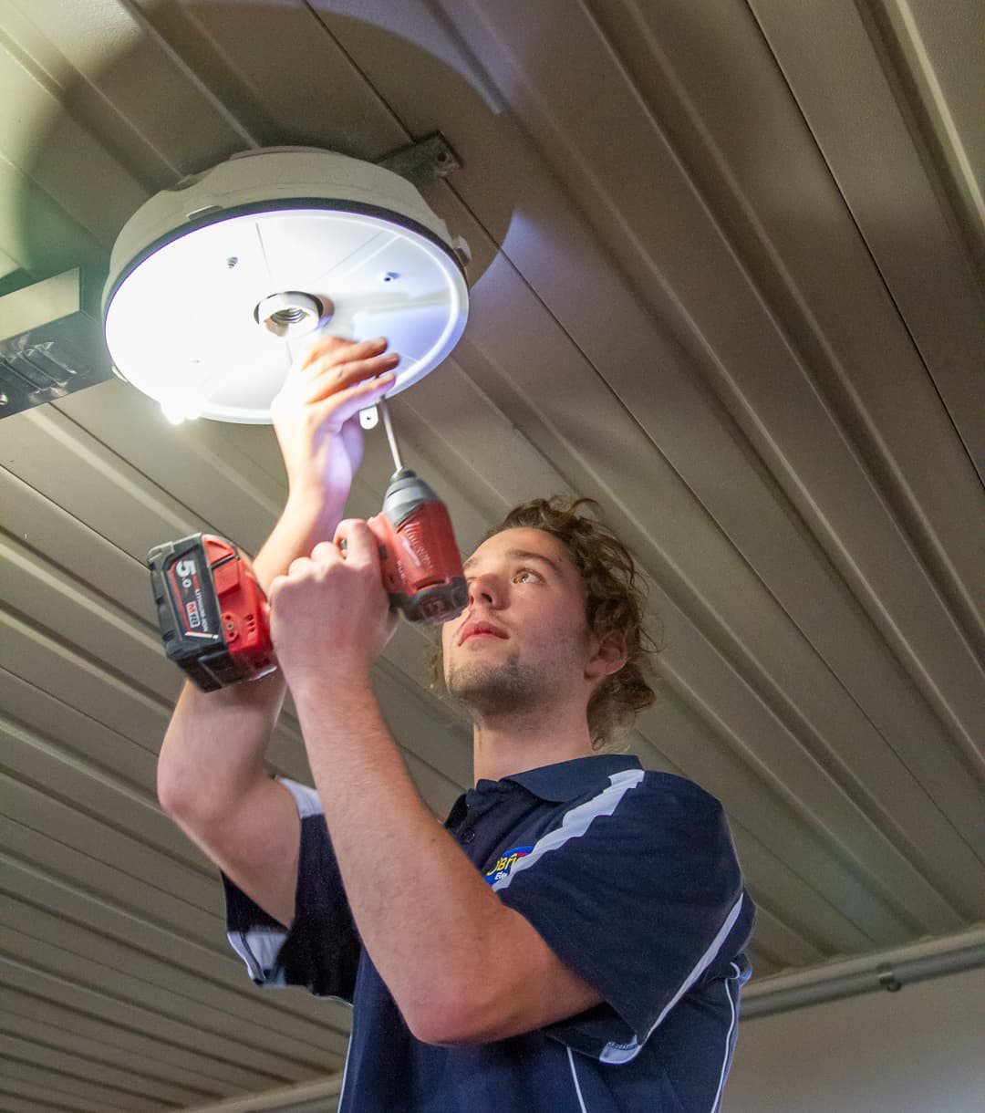 Electrician in Thomastown installing new lighting
