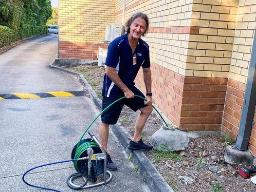 Sunshine Coast plumber clearing a blocked drain