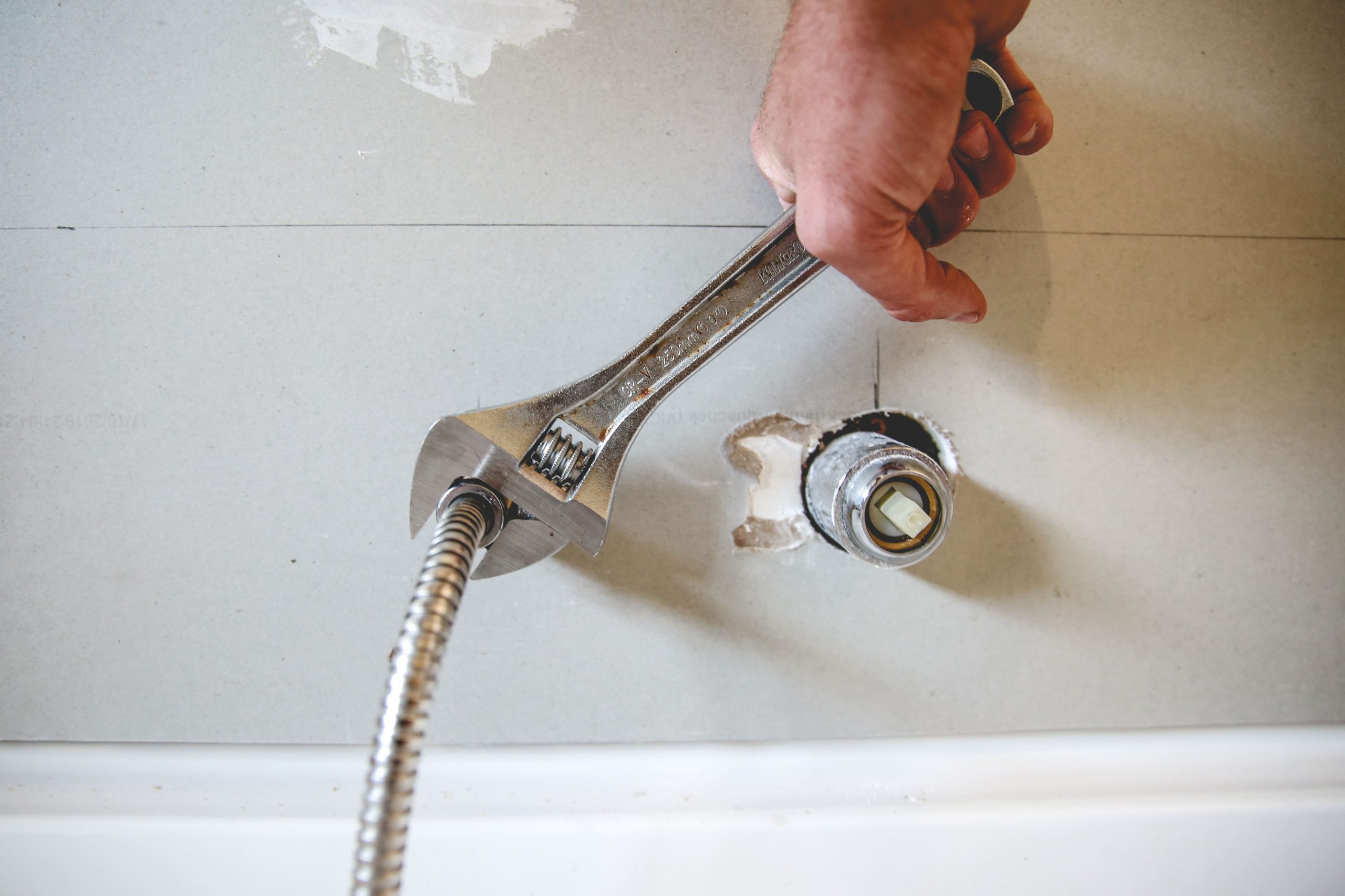 hand-wrench-during-bathroom-renovation