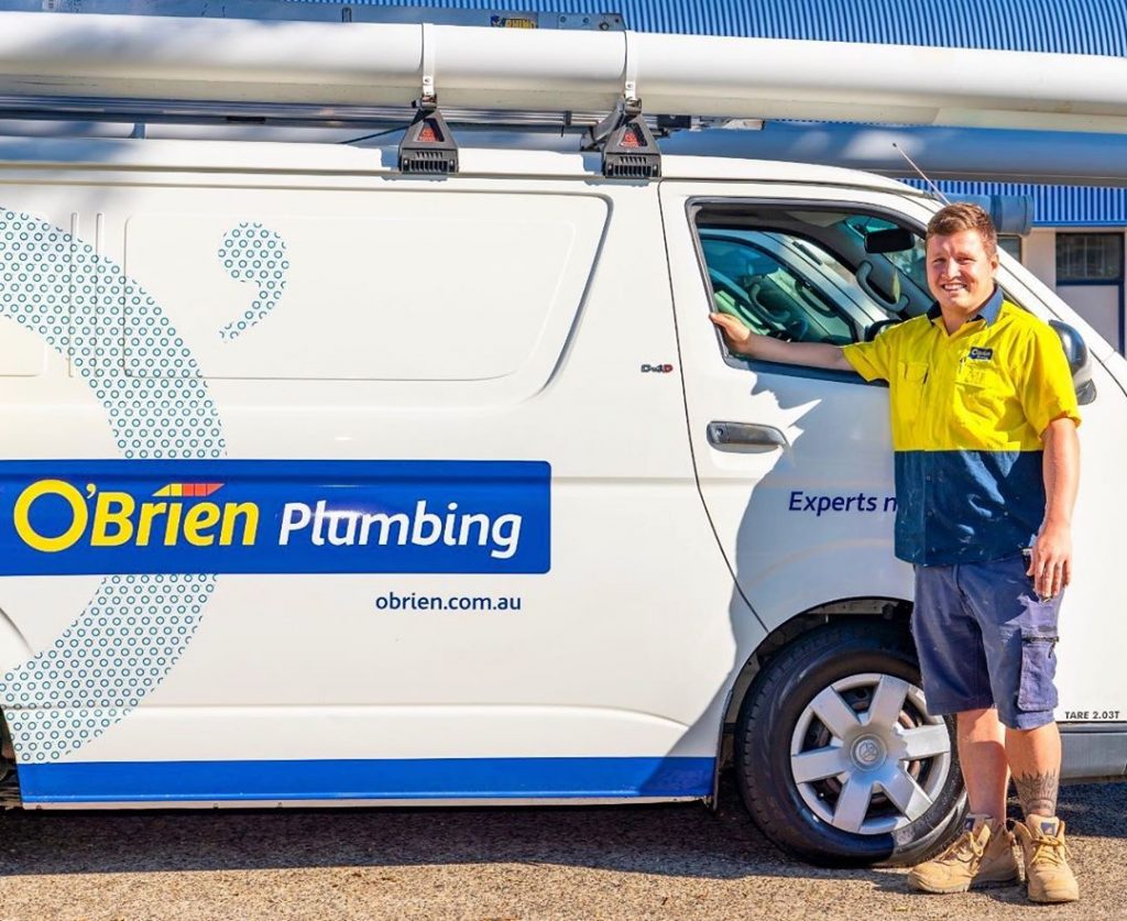 A local plumber in Coffs Harbour standing next to the O'Brien Plumbing van