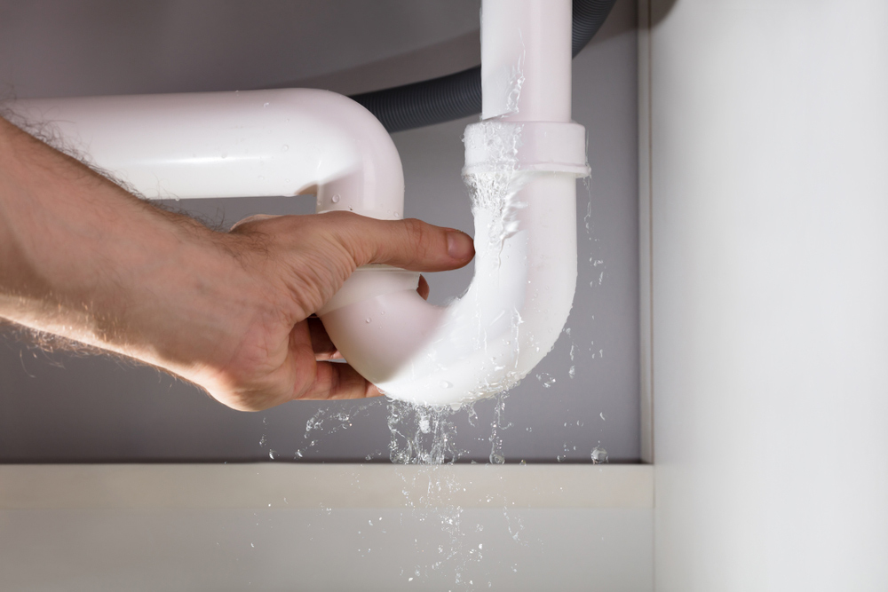 An Emergency Plumber fixing a pipe at a home in Greater Melbourne