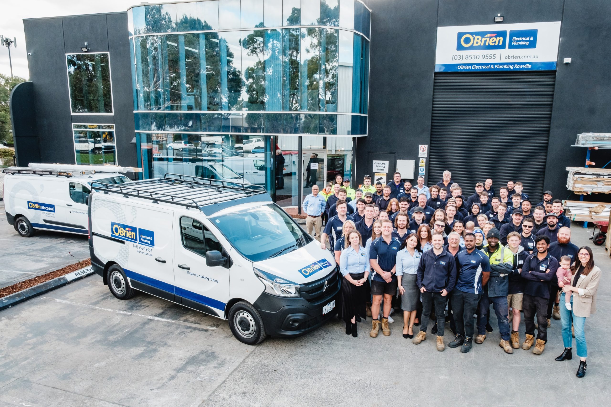 obrien-electrical-and-plumbing-rowville-team-and-service-vehicles-infront-of-branch
