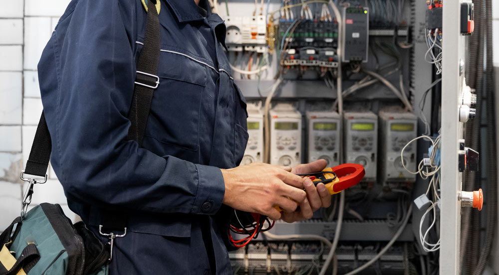 An electrician checking a power box