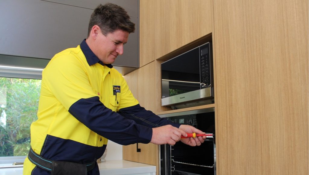 Bendigo electrician installing oven in residential kitchen