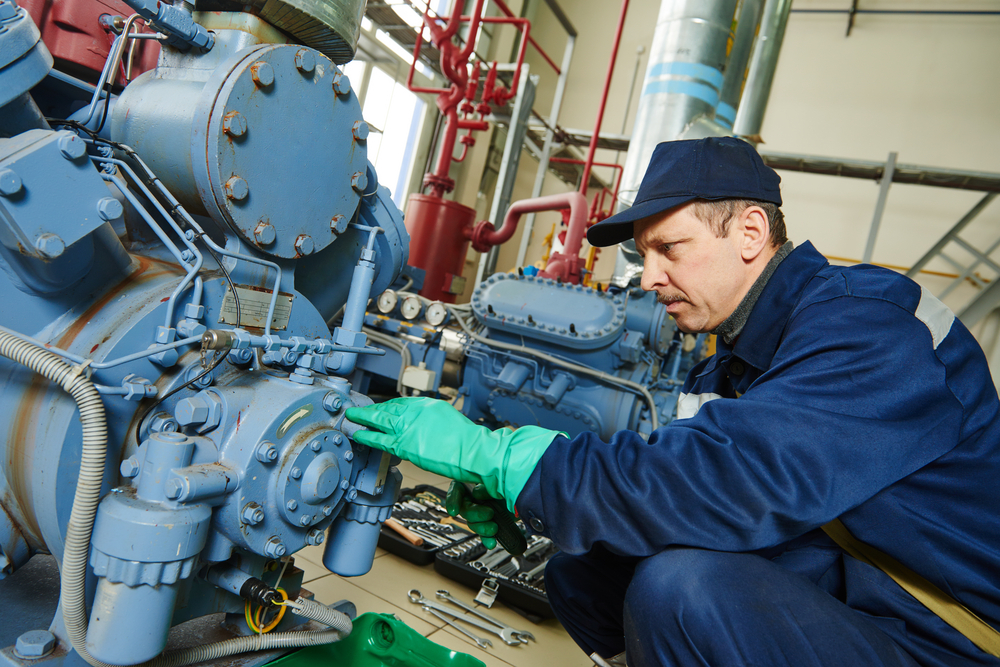 An electrician completing electrical maintenance services