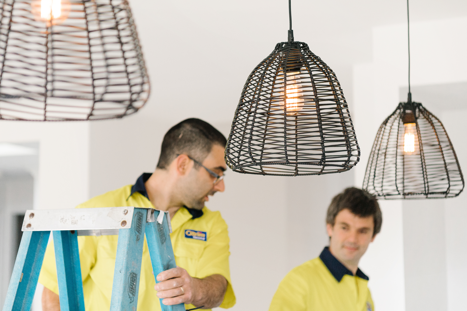 Electricians working in a home