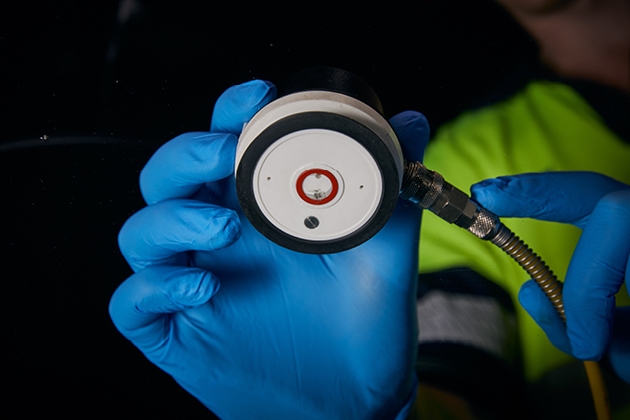 O'Brien® Autoglass staff member repairing a chipped windscreen.