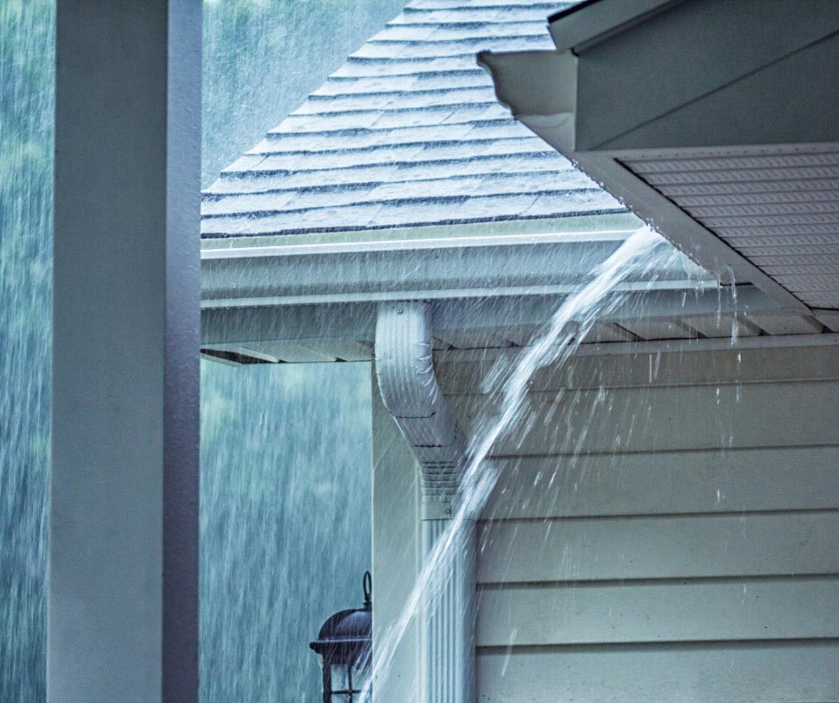 Raining Hard And Roof With Damaged Gutter