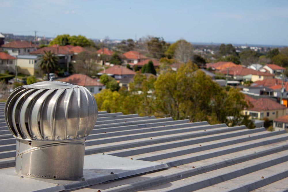 Whirlybirds On The Roof Of A House