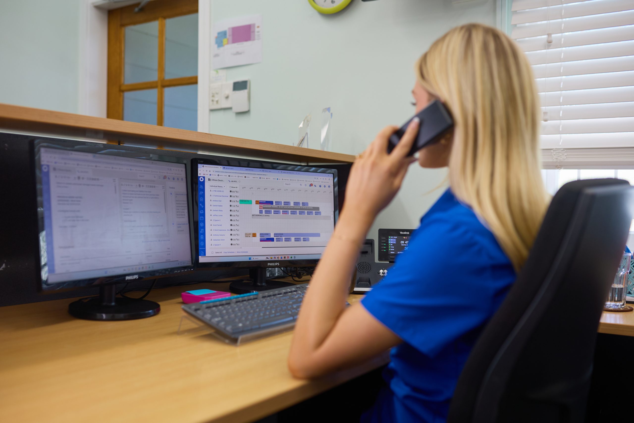 obrien receptionist on the phone booking a job